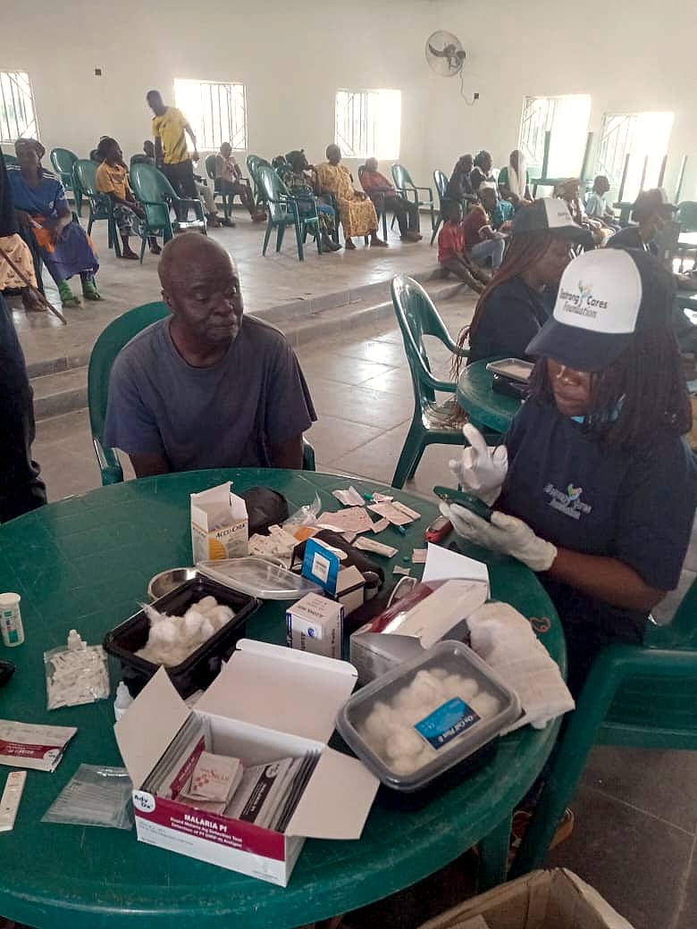 An elderly man receiving a health check