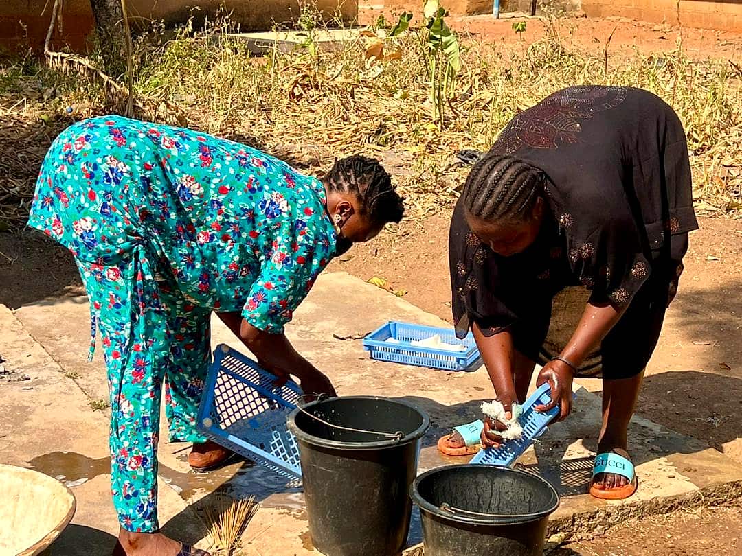 Care volunteers washing clothes